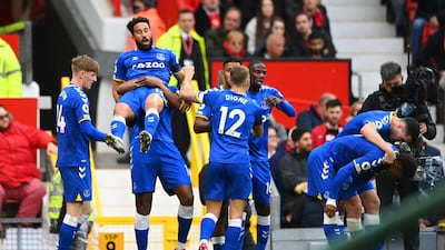 Everton winger Andros Townsend celebrates with teammates after scoring the equalising goal against Manchester United at Old Trafford on Saturday, October 2, 2021. Getty
