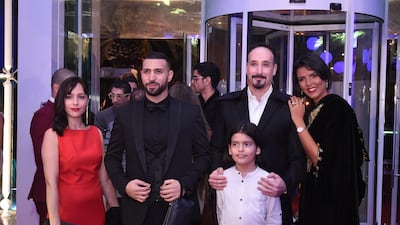 The cast of the Tunisian film 'Regarde moi' (Left to right): French actress Anna Parigi, Tunisian actor Nidhal Saadi, Tunisian director Nejib BelKadhi, young Tunisian actor Idriss Kharroubi and Tunisian actress Abir Bannani pose for a picture upon their arrival for the opening of the 29th edition of the Carthage Film Festival in Tunis. AFP