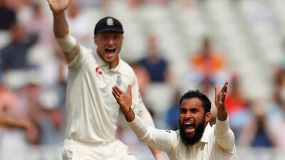England's Adil Rashid celebrates the wicket of India's Ishant Sharma with his teammates. Reuters