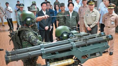 Taiwan President Lai Ching-te, centre, watches a demonstration of the US-made Stinger air defence system during a visit to inspect troops in Taoyuan. AFP