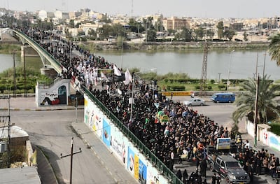 Iraqi Shiite pilgrims stage a procession in the southern city of Nasiriyah to mark the death anniversary of Imam Mousa Al Kadhim on March 21, 2020. AFP