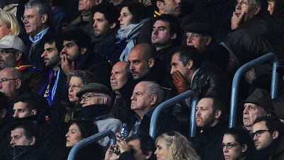 Bayern Munich coach Pep Guardiola, former Barca manager, watches Barcelona in their 1-0 victory over Manchester City in the Champions League on Wednesday. David Ramos / Getty Images