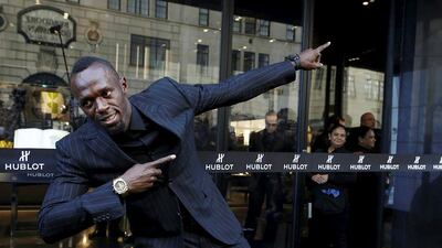 Usain Bolt strikes his signature pose to celebrate the opening of the flagship Hublot store on Fifth Avenue in the Manhattan. Andrew Kelly / Reuters