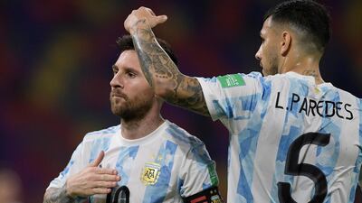 Lionel Messi celebrates with Leandro Paredes after scoring against Chile. EPA