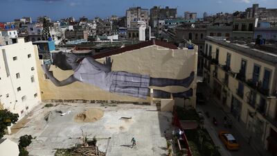 A giant photograph of a boy by French photographer and artist JR is seen on a wall. REUTERS