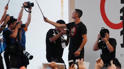 Ronaldo takes a selfie photo with fans. EPA