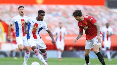 Crystal Palace's Wilfried Zaha runs at United defender Victor Lindelof. Reuters