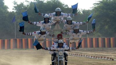 Indian army soldiers from the Dare Devil team perform on September 16, 2016, for 75th anniversary of the 8th Mechanised Infantry (7 Punjab) at Khasa, some 15 kilometres from Amritsar. The battalion was raised on May 5, 1941, and took part in the Burma campaign of the Second World War, as well as all major operations post-independence. Narinder Nanu / Agence France-Presse