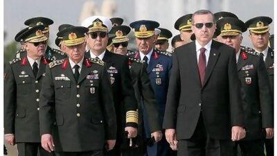 Gen Isik Kosaner, front left, next to the Turkish prime minister Recep Tayyip Erdogan, front right, at a ceremony in 2010.