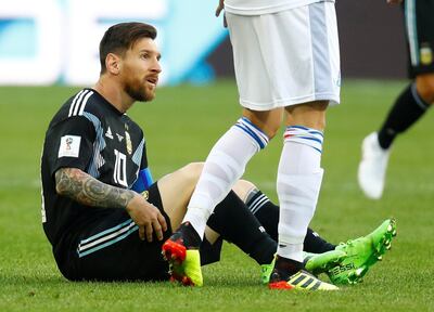 Argentina's Lionel Messi takes a tumble during the first half against Iceland. looks on. Kai Pfaffenbach / Reuters
