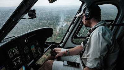 A pilot follows a swarm of desert locusts during a surveillance flight as farmers set fires to create smoke in their attempt to chase away the insects from fields in Meru, Kenya. AFP