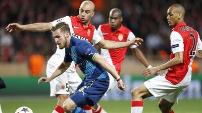 Arsenal's Aaron Ramsey tries to dribble past Monaco's Aymen Abdennour during their Champions League last 16 second leg match on Tuesday, Valery Hache / AFP / March 17, 2015