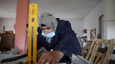 A Palestinian woman works at a carpenter workshop, established and run by a group of women, in the village of Al Walajeh near the West bank town of Bethlehem. AFP