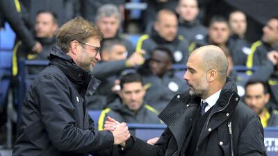 Jurgen Klopp, left, and Liverpool host Pep Guardiola, right, and Manchester City in the Premier League on Sunday. Dave Thompson / AP Photo