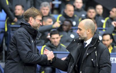 Jurgen Klopp, left, and Pep Guardiola. AP