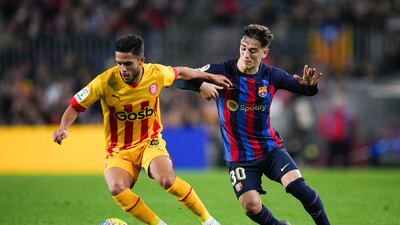 Yan Couto of Girona fights for the ball with Gavi of Barcelona during their LaLiga clash at Camp Nou on April 10, 2023. Getty