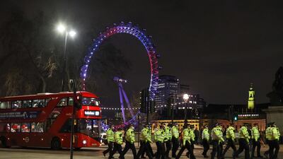 Police officers make their way across Westminster Bridge. Reuters