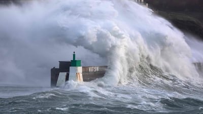 A huge wave crashes on the harbor at Le Conquet, north-west France. AFP