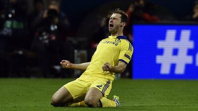Branislav Ivanovic slides in celebration after opening the scoring for Chelsea. Franck Fife / AFP