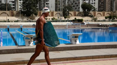 Egyptian swimmer Omar Sayed Shaaban, 21, who has broken the record for the highest out-of-water jump while wearing a monofin, arrives for a training session at Cairo Stadium Swimming Pools, Egypt. Reuters