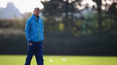 Manager Arsene Wenger of Arsenal conducts a team training session on Tuesday ahead of their Wednesday match against Galatasaray in the Champions League. Paul Gilham / Getty Images / September 30, 2014