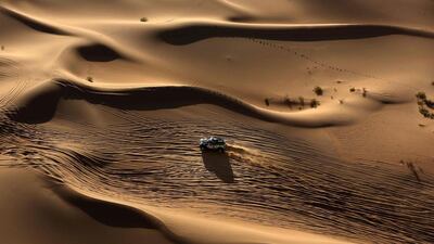 Yazeed Mohamed Al Rahji and co-pilot Timo Gottschalk drive along Inner Mongolia’s Gobi desert at the end of the 13th special stage of the Silkway Rally. Patrick Baz / AFP Photo