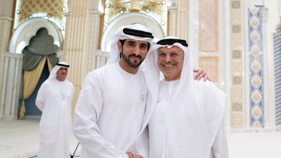 Sheikh Hamdan bin Mohammed, Crown Prince of Dubai, pictured with Dr Anwar Gargash, Minister of State for Foreign Affairs (R), at an Iftar reception at Qasr Al Watan. Mohamed Al Hammadi / Ministry of Presidential Affairs