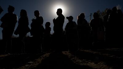 People stand in line for their chance to view the solar eclipse through a telescope in an astronomical complex at the University Mayor de San Andres in La Paz, Bolivia. AP Photo
