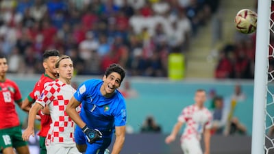 Morocco goalkeeper Yassine Bounou is beaten by Mislav Orsic's shot. AP