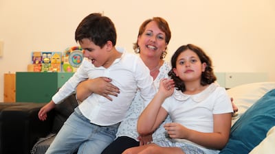Em Ray with her son Sam and daughter Maya at home in Mirdif, Dubai. Pawan Singh / The National