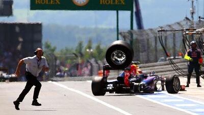 A tyre off Mark Webber's car went rolling down the pit lane, hurting a cameraman at the German Grand Prix. Srdjan Suki / EPA