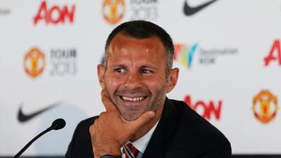 Ryan Giggs can look on the funny side during a news conference on Sunday in Sydney. Daniel Munoz / Reuters