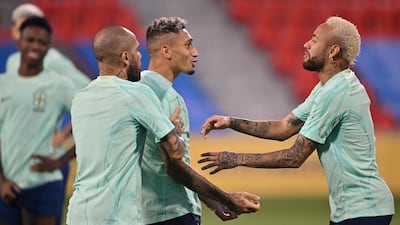 Dani Alves, Raphinha and Neymar. AFP