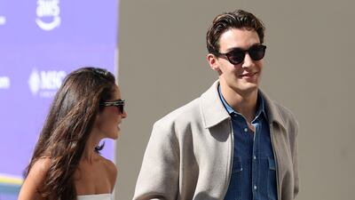 Mercedes driver George Russell arrives at the Yas Marina Circuit.