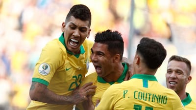 Brazil's Casemiro, centre, celebrates with teammates after scoring against Peru during their Copa America Group A match at the Corinthians Arena in Sao Paulo. AFP