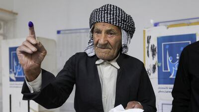 A Kurdish man shows his inked finger while voting at a polling station during Iraq's Kurdistan regional parliamentary election in Sulaimaniya, Iraq, on Sunday. Reuters