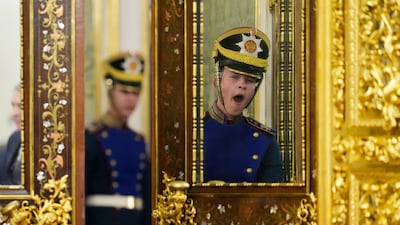 An honour guard yawns before a meeting between Russia's President Vladimir Putin and Mozambique's President Daniel Chapo, during the summit of heads of state of the Gas Exporting Countries Forum, in Moscow. Reuters