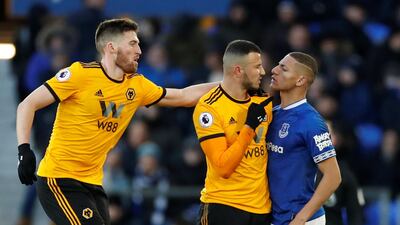 Everton's Richarlison, right, clashes with Wolverhampton Wanderers' Romain Saiss at Goodison Park. Reuters