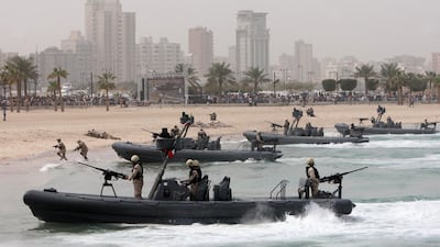Kuwaiti troops show off their skills during a military show in Kuwait City on February 28, 2011. Yasser Al Zayyat / AFP