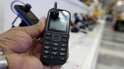 Despite smartphones being all the rage, a hard core of people refuse to consume their days with technology, instead opting for basic, non-internet phones like this Nokia. Pawan Singh / The National