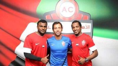 Al Ahli coach Sanchez Flores flanked by his two new goalkeeper signings, Ali Rabea (from Ajman), left, and Majed Naser (from Al Wasl).