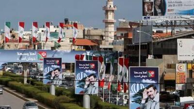 Advertising boards featuring images of the Iranian president, Mahmoud Ahmadinejad, decorate a street in Beirut’s suburbs, ahead of his two-day visit, which begins on Wednesday.