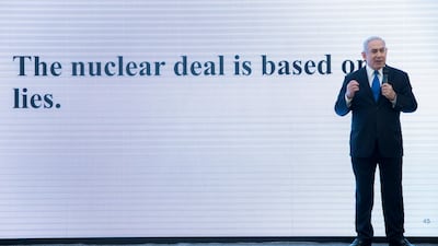 Israeli PM Benjamin Netanyahu describes how Iran has continued with its nuclear capabilities with the purpose of making atomic weapons, in the Israeli Defense Ministry in Tel Aviv. JIM HOLLANDER