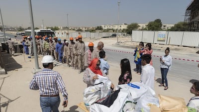 Winchester School pupils donate used electrical items to labourers under the Pass it On project. Antonie Robertson / The National