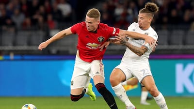 Scott McTominay holds off Leeds United's Kemar Roofe. EPA