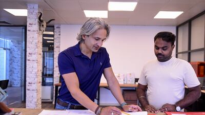 Studio manager Saran Raj, from Tamil Nadu, discusses computerised sketches for new designs with Riaz.