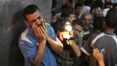 A Palestinan man cries in mourning over a victim killed in an explosion, in the mortuary at Shifa hospital in Gaza City yesterday.