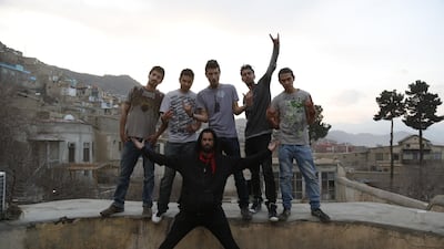 'District Unknown', from left, Qasem, Qais, Pedram, Yousef and Lemar with director Travis Beard, front, rocking out in Kabul. Courtesy Travis Beard
