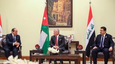 King Abdullah meets Mr Shia Al Sudani, right, and Mr El Sisi on the sidelines of the conference. AFP