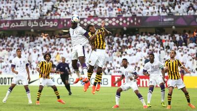 Al Ain striker Asamoah Gyan, centre, in white jersey, scored last week against Al Ittihad and has 11 goals in this year’s Asian Champions League. Al Ittihad